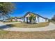 Newly built home with light blue exterior, landscaping, and a two-car garage at 12119 Creek Preserve Dr, Riverview, FL 33579