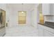 Kitchen nook with striped curtains and white tile floor at 12119 Creek Preserve Dr, Riverview, FL 33579