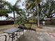 Large backyard with patio, grill, and lush landscaping at 12264 103Rd St, Largo, FL 33773