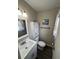 Small bathroom with white vanity and nautical decor at 12264 103Rd St, Largo, FL 33773