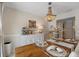 Bright dining area with a rustic wooden table and white buffet at 13472 Bellewood Ave, Seminole, FL 33776