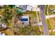 Bird's-eye view of a house with a yard and driveway at 1434 Longwood Loop, Tampa, FL 33619