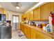 Efficient galley kitchen with wood cabinets at 1434 Longwood Loop, Tampa, FL 33619