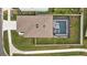 Aerial view of house with pool, located in a quiet residential neighborhood at 16961 Oval Rum Dr, Wimauma, FL 33598