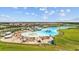 Aerial view of the expansive lagoon pool and beach area at 16961 Oval Rum Dr, Wimauma, FL 33598