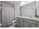 Bathroom with double vanity and shower/tub combo at 16961 Oval Rum Dr, Wimauma, FL 33598