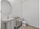 Clean and updated half bathroom with pedestal sink at 16961 Oval Rum Dr, Wimauma, FL 33598