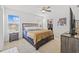 Spacious bedroom with a walk-in closet and large window at 16961 Oval Rum Dr, Wimauma, FL 33598