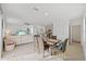 Open dining area with table and chairs, view of living room at 16961 Oval Rum Dr, Wimauma, FL 33598