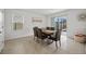 Dining room with table and chairs, view of the pool at 16961 Oval Rum Dr, Wimauma, FL 33598