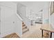 Bright and airy entryway with stairs, light-colored walls, and console table at 16961 Oval Rum Dr, Wimauma, FL 33598