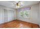 Bedroom with hardwood floors and large closet at 17 Venetian Ct, Tarpon Springs, FL 34689