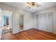 Bright bedroom with wood floors and ample closet space at 17 Venetian Ct, Tarpon Springs, FL 34689