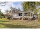 Single story home with large yard and screened porch at 17 Venetian Ct, Tarpon Springs, FL 34689