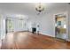 Hardwood floors and chandelier in spacious living room at 17 Venetian Ct, Tarpon Springs, FL 34689