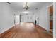 Hardwood floors and chandelier in spacious living room at 17 Venetian Ct, Tarpon Springs, FL 34689