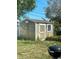 Backyard shed with tan siding and window at 1700 Kay Dr, Largo, FL 33770