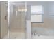 Bathroom includes shower, bathtub, and large window at 17533 Stinchar Dr, Land O Lakes, FL 34638