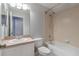 Clean bathroom with a bathtub, shower, and single sink vanity at 17533 Stinchar Dr, Land O Lakes, FL 34638