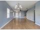 Bright dining room with hardwood floors and a view of the staircase at 17533 Stinchar Dr, Land O Lakes, FL 34638