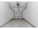 Clean and empty garage with automatic door opener at 17533 Stinchar Dr, Land O Lakes, FL 34638