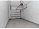 Clean and empty garage with automatic door opener at 17533 Stinchar Dr, Land O Lakes, FL 34638