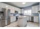 Modern kitchen with stainless steel appliances and an island at 17533 Stinchar Dr, Land O Lakes, FL 34638