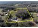 Aerial view showing a house on a large lot with surrounding trees at 18420 Burrell Rd, Odessa, FL 33556