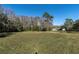 Spacious backyard with view of house at 18420 Burrell Rd, Odessa, FL 33556