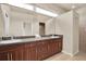 Double vanity bathroom with dark wood cabinets at 18420 Burrell Rd, Odessa, FL 33556