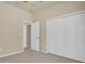 Bedroom with closet and access to hallway at 18420 Burrell Rd, Odessa, FL 33556