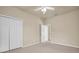 Bright bedroom featuring double door closet at 18420 Burrell Rd, Odessa, FL 33556