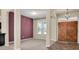 Dining room with an accent wall and wood floors at 18420 Burrell Rd, Odessa, FL 33556