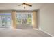 Living area featuring French doors and a view of the backyard at 18420 Burrell Rd, Odessa, FL 33556