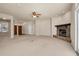 Open living room with a stone fireplace and neutral decor at 18420 Burrell Rd, Odessa, FL 33556