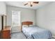 Bright bedroom featuring a ceiling fan and window at 2005 Wexford Green Dr, Valrico, FL 33594