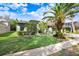 House exterior showcasing a landscaped yard and a two-car garage at 2005 Wexford Green Dr, Valrico, FL 33594