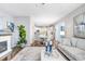 Bright and airy living area featuring hardwood floors and a view into the kitchen at 2005 Wexford Green Dr, Valrico, FL 33594