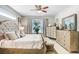 Main bedroom with plush bed and ample dresser space at 2005 Wexford Green Dr, Valrico, FL 33594