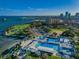 Aerial view of waterfront community with pools, park, and beach at 216 21St Ne Ave, St Petersburg, FL 33704