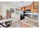 Small kitchen with granite countertops and wood cabinets at 216 21St Ne Ave, St Petersburg, FL 33704