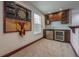 Basement bar area with cabinetry and dartboard at 2291 Bolzano Ct, Land O Lakes, FL 34639