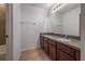 Simple bathroom with a vanity, mirror and tile floors at 2291 Bolzano Ct, Land O Lakes, FL 34639