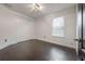 Simple bedroom with dark wood floors and a double door closet at 2291 Bolzano Ct, Land O Lakes, FL 34639