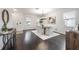 Bright dining room with dark hardwood floors and stylish furnishings at 2291 Bolzano Ct, Land O Lakes, FL 34639