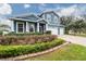 Two-story house with blue siding, white trim, and a landscaped front yard at 2291 Bolzano Ct, Land O Lakes, FL 34639