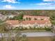 An aerial view of a townhome community, showing the buildings and road at 2648 Tanglewood Trl, Palm Harbor, FL 34685