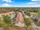 Aerial view of townhouses, showcasing their design and surrounding greenery at 2648 Tanglewood Trl, Palm Harbor, FL 34685