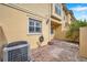 AC unit and small patio visible in this backyard view at 2648 Tanglewood Trl, Palm Harbor, FL 34685