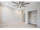 Bedroom with ceiling fan and double door closet at 2648 Tanglewood Trl, Palm Harbor, FL 34685